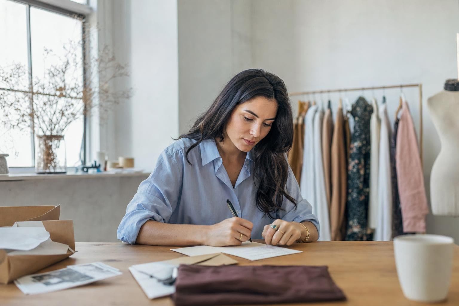 A photo of a business owner thoughtfully sending a tailored, personal message to a customer.