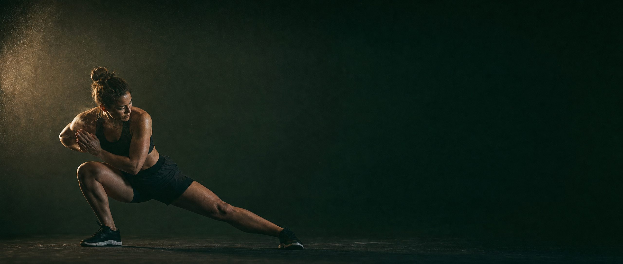 An athlete practicing controlled floor-based movement