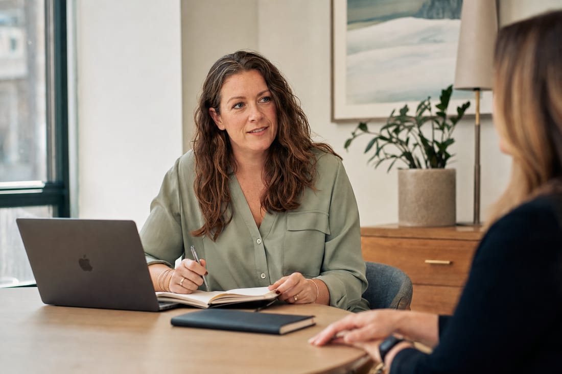 An HR consultant meeting with a colleague