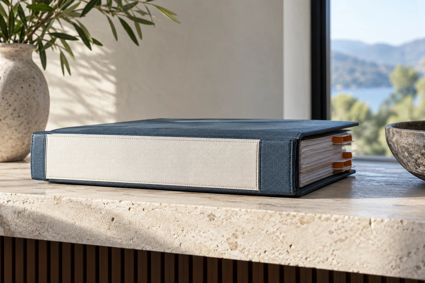 The edge of a closed policy binder with indexed tabs